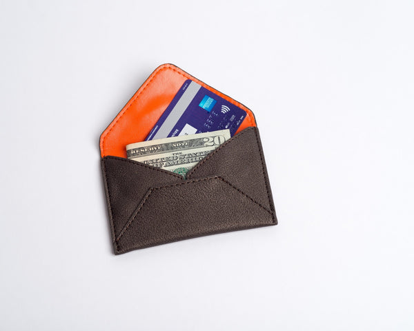 Chic & eco-friendly card case! Smith holds business cards, credit cards, MetroCards. Vegan leather, 5 colors, orange lining, embossed logo. Perfect gift! Shop now!