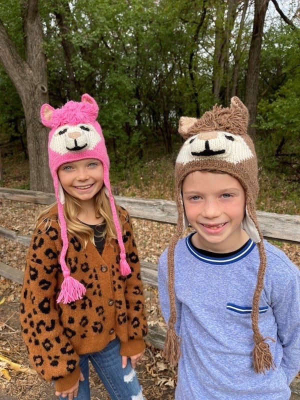 A photo of the alpaca animal hat being worn by a child