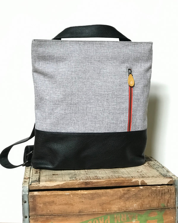 Eco-chic bag that's 3 bags in 1! ROCKAWAY transforms from tote to backpack to crossbody. Organic cotton, vegan leather, spacious, fits laptop. Perfect for work, travel, gifts. Shop now!