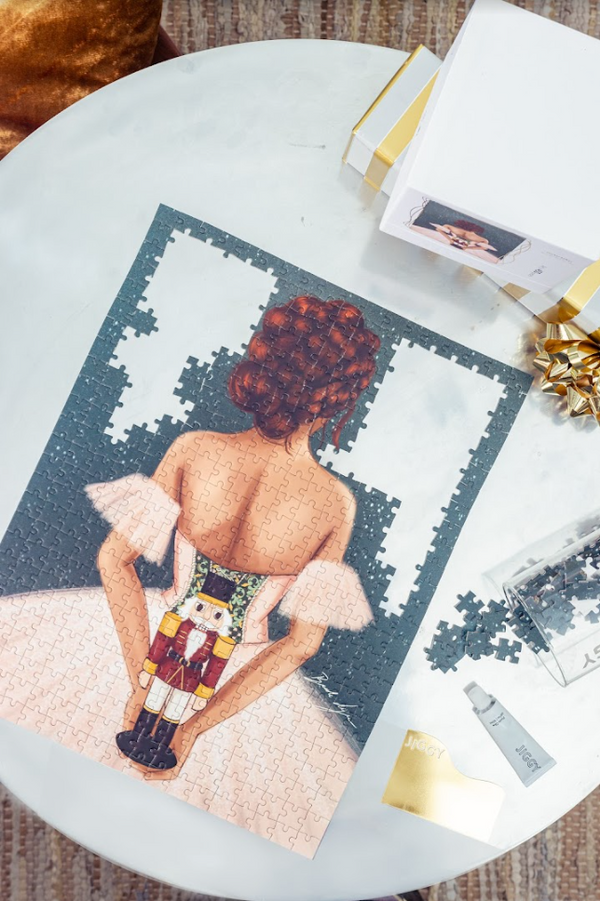 Assembled Nutcracker puzzle by Brooke Ashley with puzzle glue and straight-edge spreader tool included in the JIGGY puzzle set