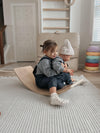 Baby wearing Apple Park organic chambray overalls, full outfit view