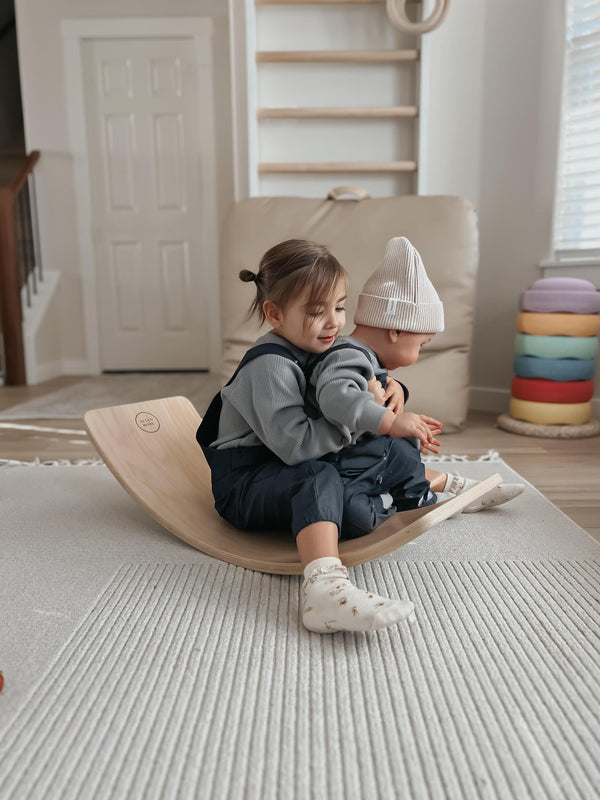 Baby wearing Apple Park organic chambray overalls, full outfit view