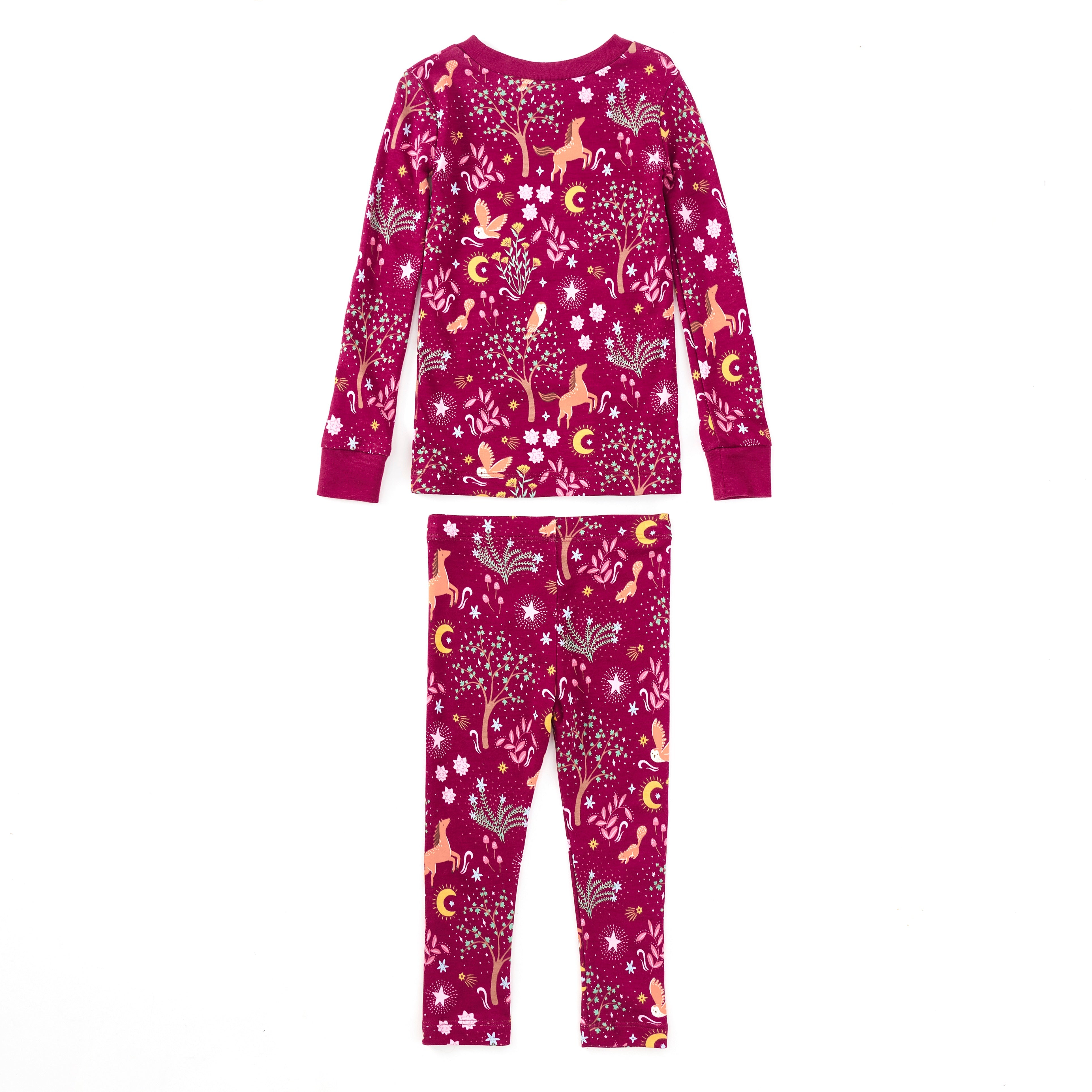 Child wearing Woodland Dreams two-piece bamboo blend pajama set with long-sleeve top and matching pants featuring horses, owls, and stars print