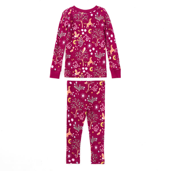 Child wearing Woodland Dreams two-piece bamboo blend pajama set with long-sleeve top and matching pants featuring horses, owls, and stars print