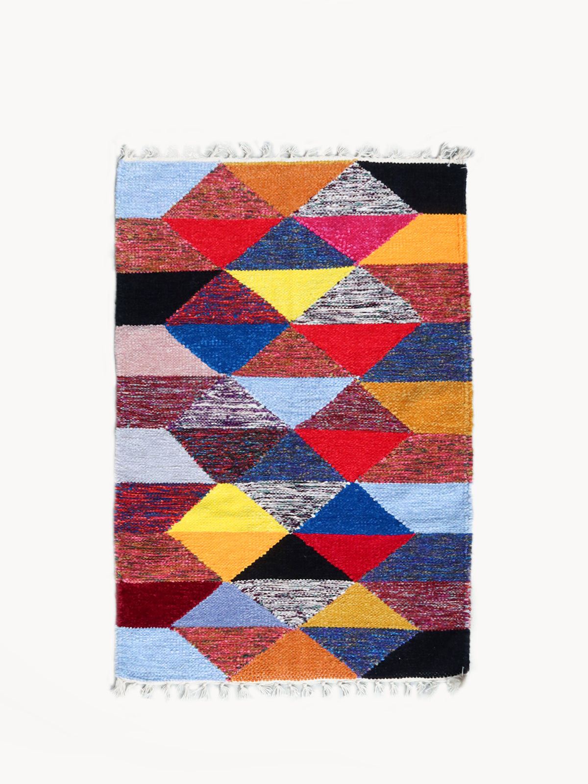 Multicolored geometric patterned rug on a white background