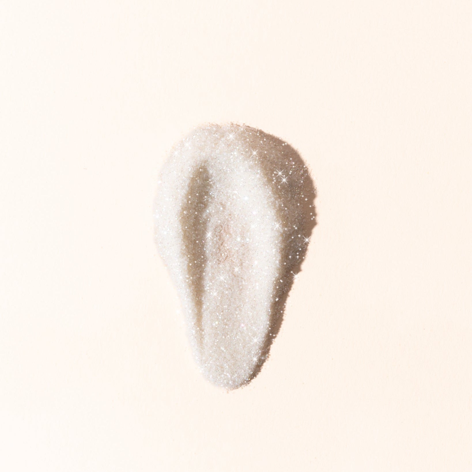 Beige makeup swatch on a light beige background