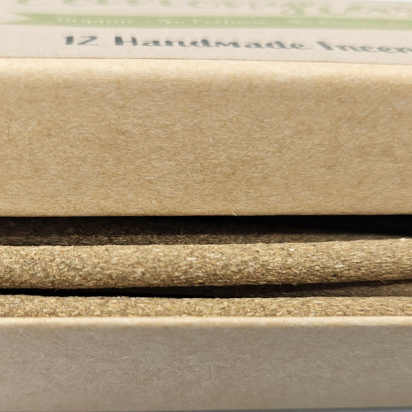 Close-up of various beige and brown paper samples with '12 Handmade' text.