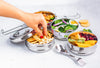 Ecozoi round bento lunch box open with stainless steel spork resting on top tier