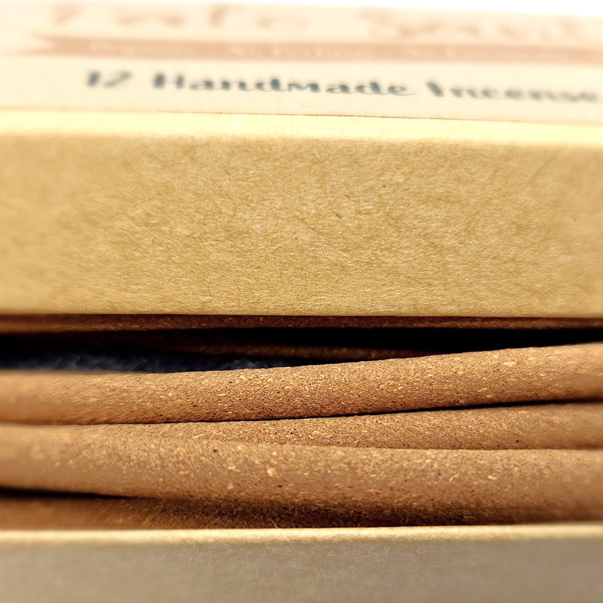 Close-up of brown incense sticks with a blurred background