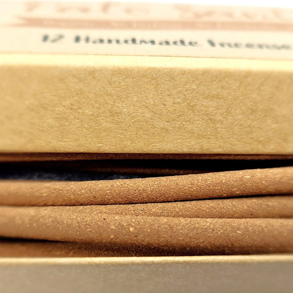 Close-up of brown incense sticks with a blurred background