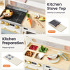 Toy kitchen playset shown in two usage modes: a kitchen stove top with food accessories for stirring and cutting, and a kitchen preparation station with food containers, a plate, and utensils. The set includes a cream-colored play kitchen with gold-tone knobs, a black stovetop, and various colorful play food items.