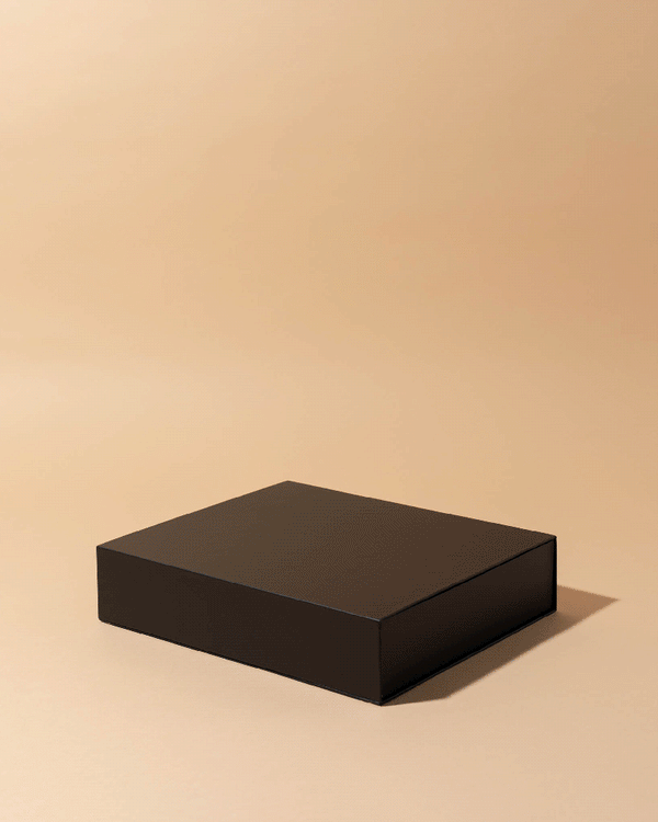 Animated gif showing makesy® black magnetic candle box opening to reveal 2.5oz aura candle jar