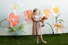 Apple Park Summer Bounty doll dress with flutter sleeves styled on a doll, displayed in a bright lifestyle setting