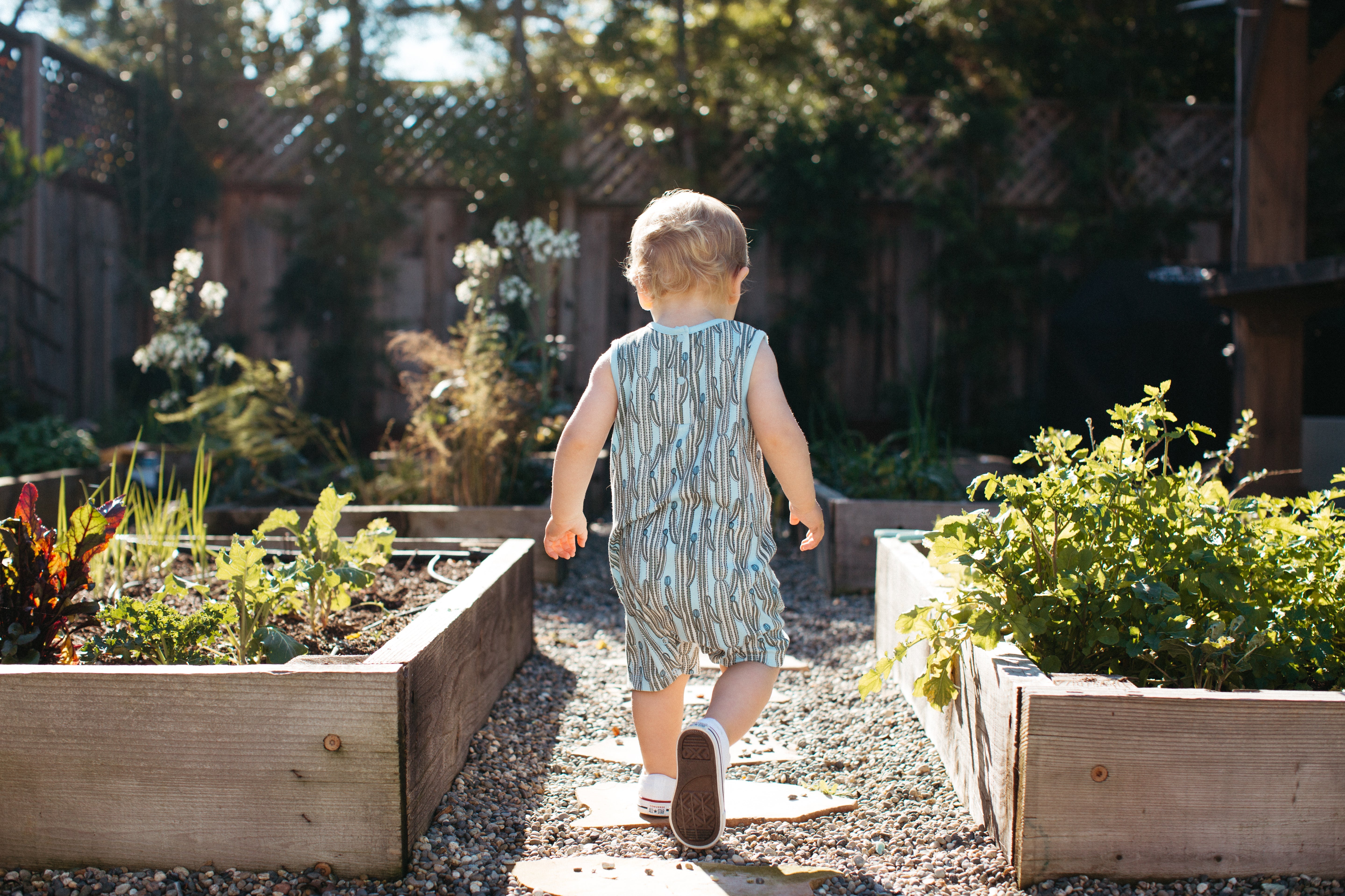 Baby modelling the Apple Park Blooming Saguaro organic cotton bamboo sleeveless romper