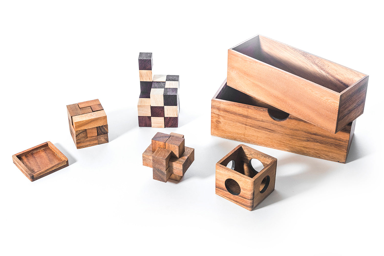 Collection of wooden puzzle boxes on a white background