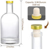 Clear glass bottle with gold cap and measurements on a white background