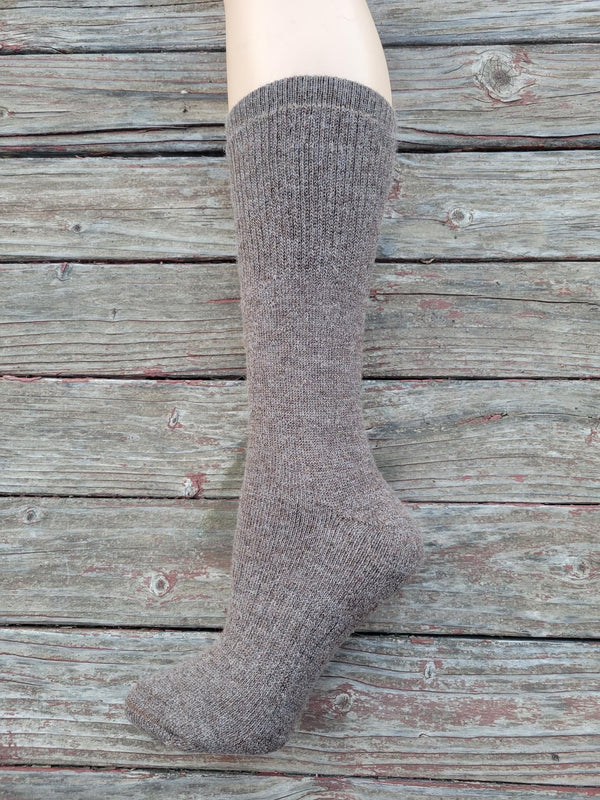 Gray sock on a wooden surface