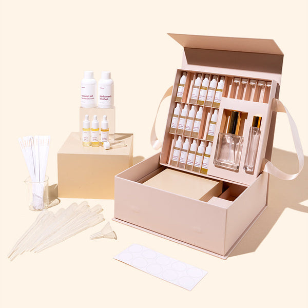 makesy DIY perfume making starter kit laid out with fragrance blending tools and bottles