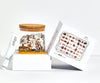 JIGGY Boobs puzzle pieces spread out on a flat surface with reusable glass jar packaging