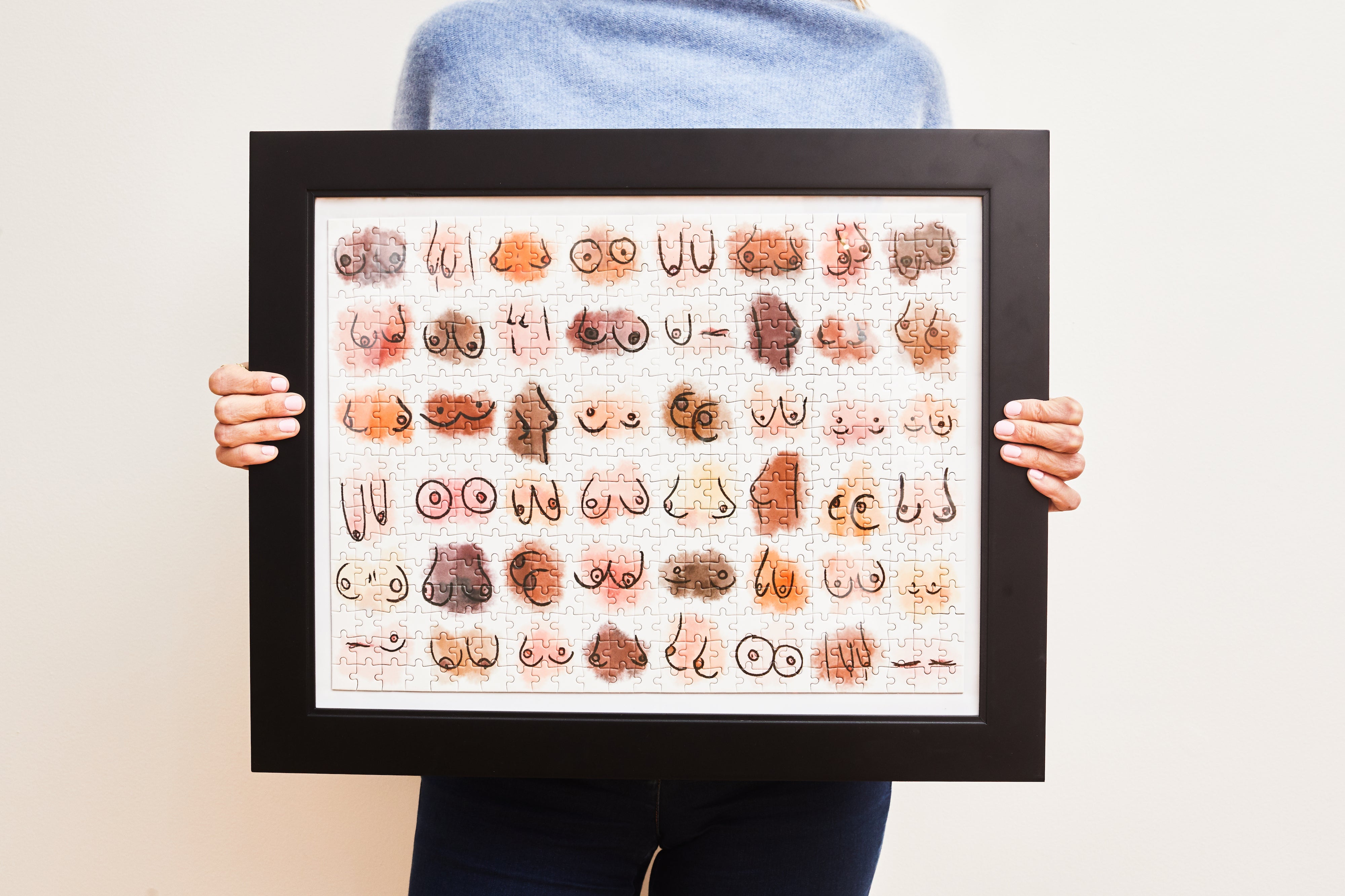 Close-up of Boobs puzzle by Julia Heffernan showing watercolour art detail and puzzle pieces
