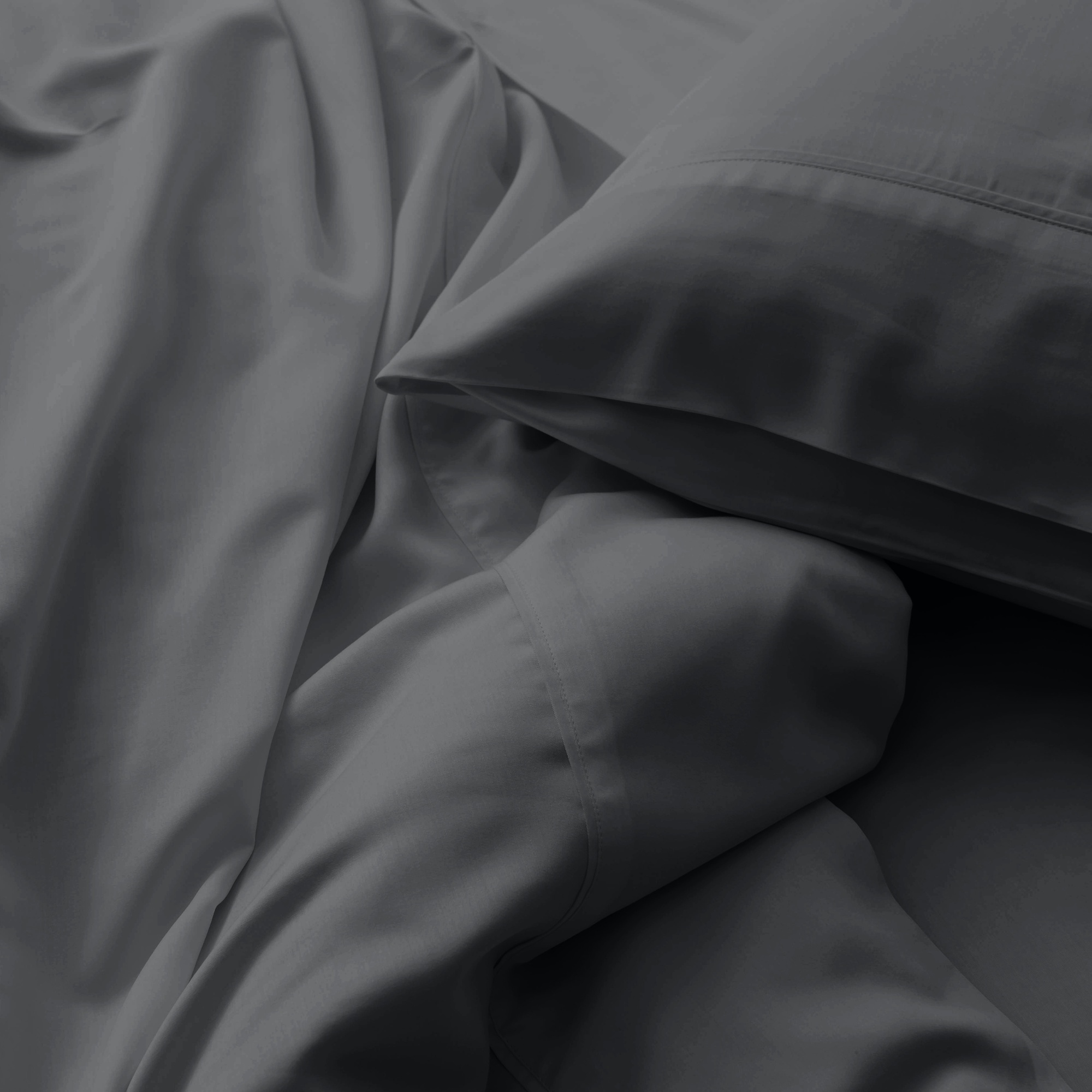 Close-up of dark gray fabric with folds