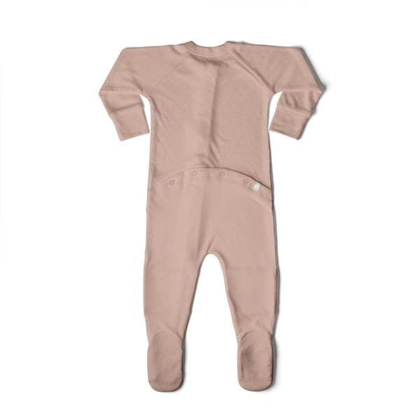 Pink baby onesie with footies on a white background