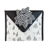 Flat lay of EverBow black grosgrain bow — sustainable reusable gift wrapping accessory