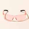 Close-up of makesy® pink safety glasses showing integrated nose piece and panoramic lens detail