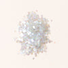White glitter on a light beige background