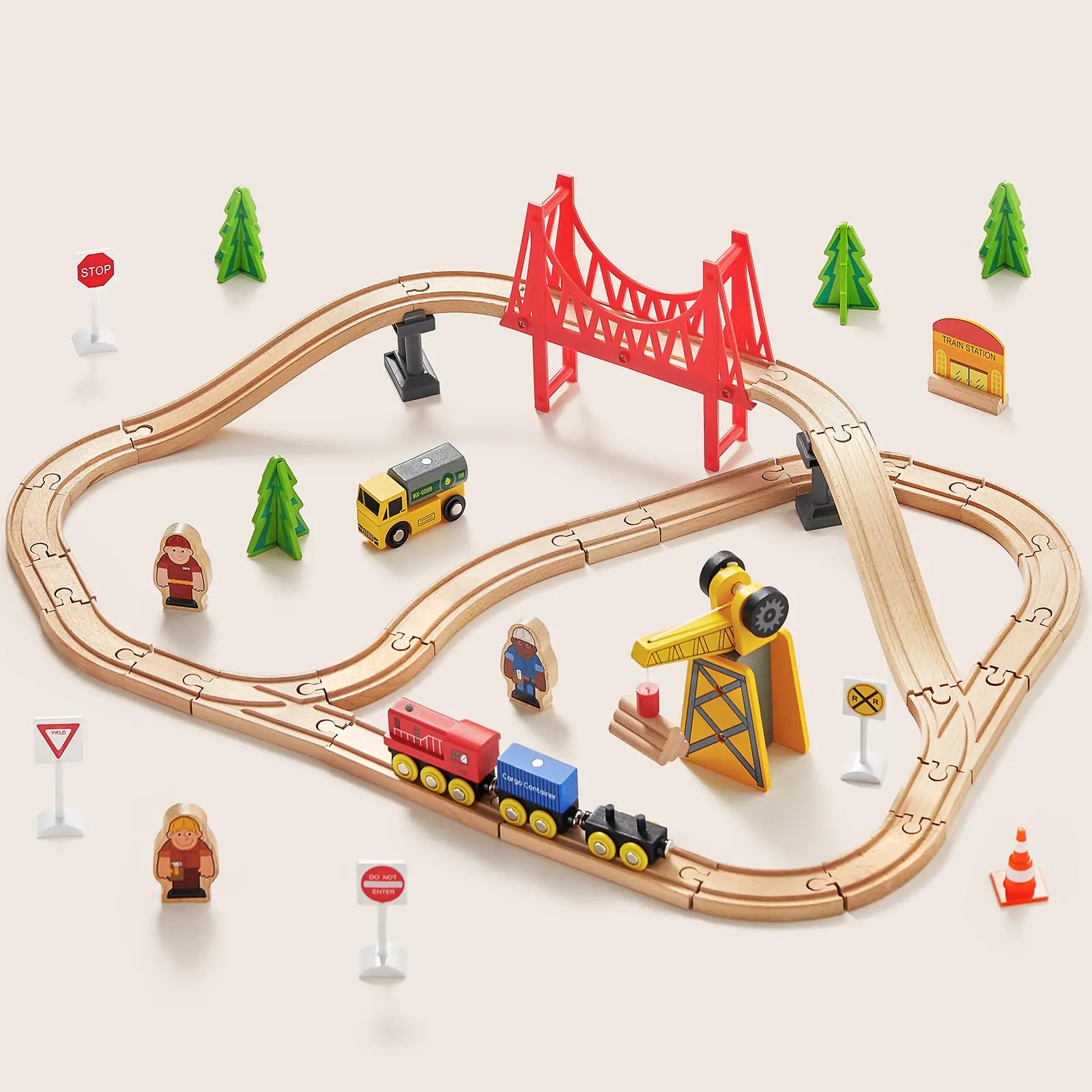 Toy train set with tracks, cars, and accessories on a light background