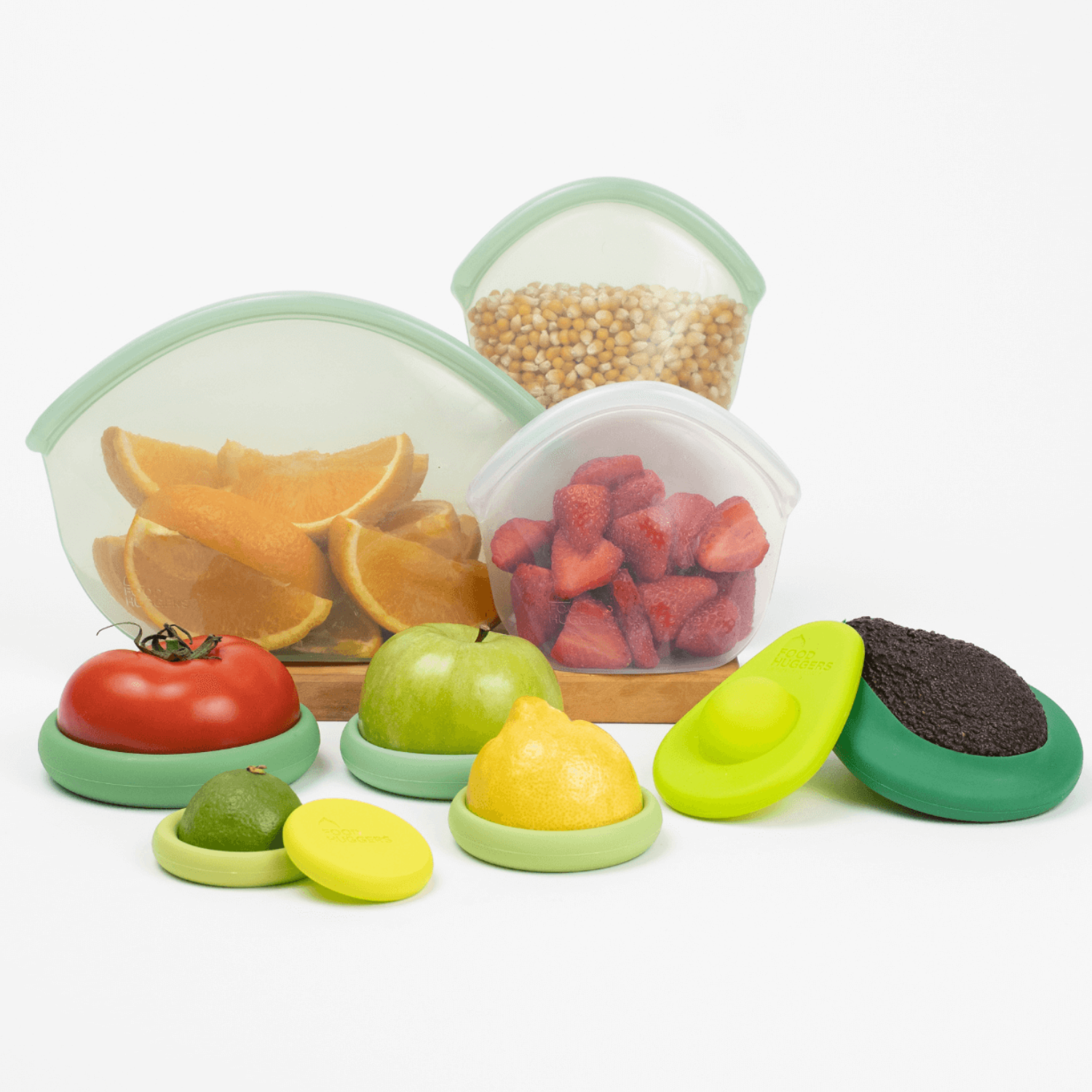 Reusable Hugger Bags and Food Huggers from the Food Huggers Eco Essentials Bundle on a kitchen counter