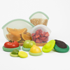 Reusable Hugger Bags and Food Huggers from the Food Huggers Eco Essentials Bundle on a kitchen counter