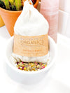 Close-up of certified organic bath tea sachet for babies, filled with chamomile, calendula and oats