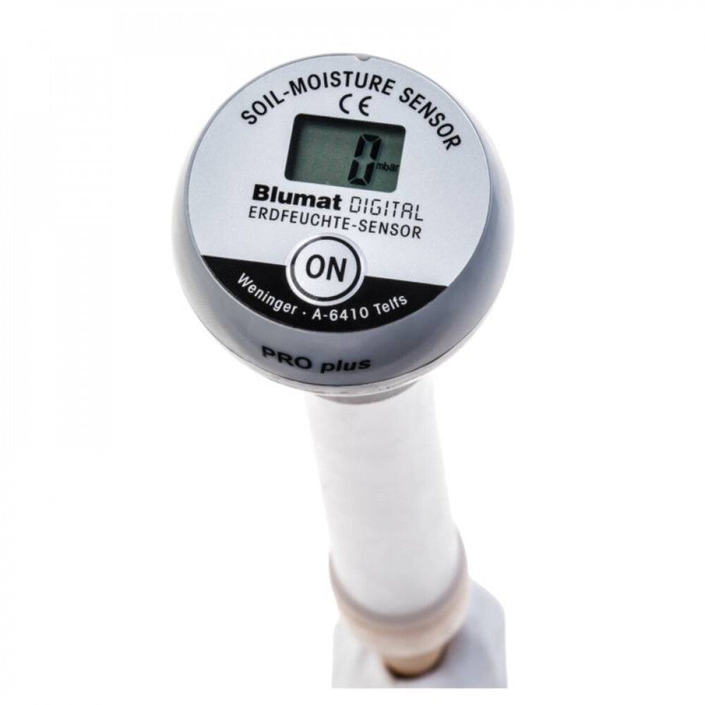 Blumat Digital Moisture Meter inserted into potted plant soil for accurate moisture reading