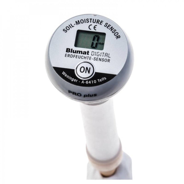 Blumat Digital Moisture Meter inserted into potted plant soil for accurate moisture reading