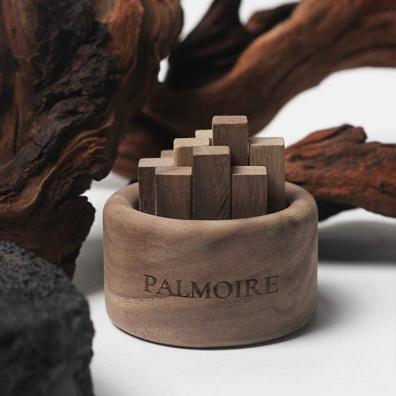 Wooden puzzle set in a wooden container with 'Palmoire' branding, surrounded by natural wood elements.