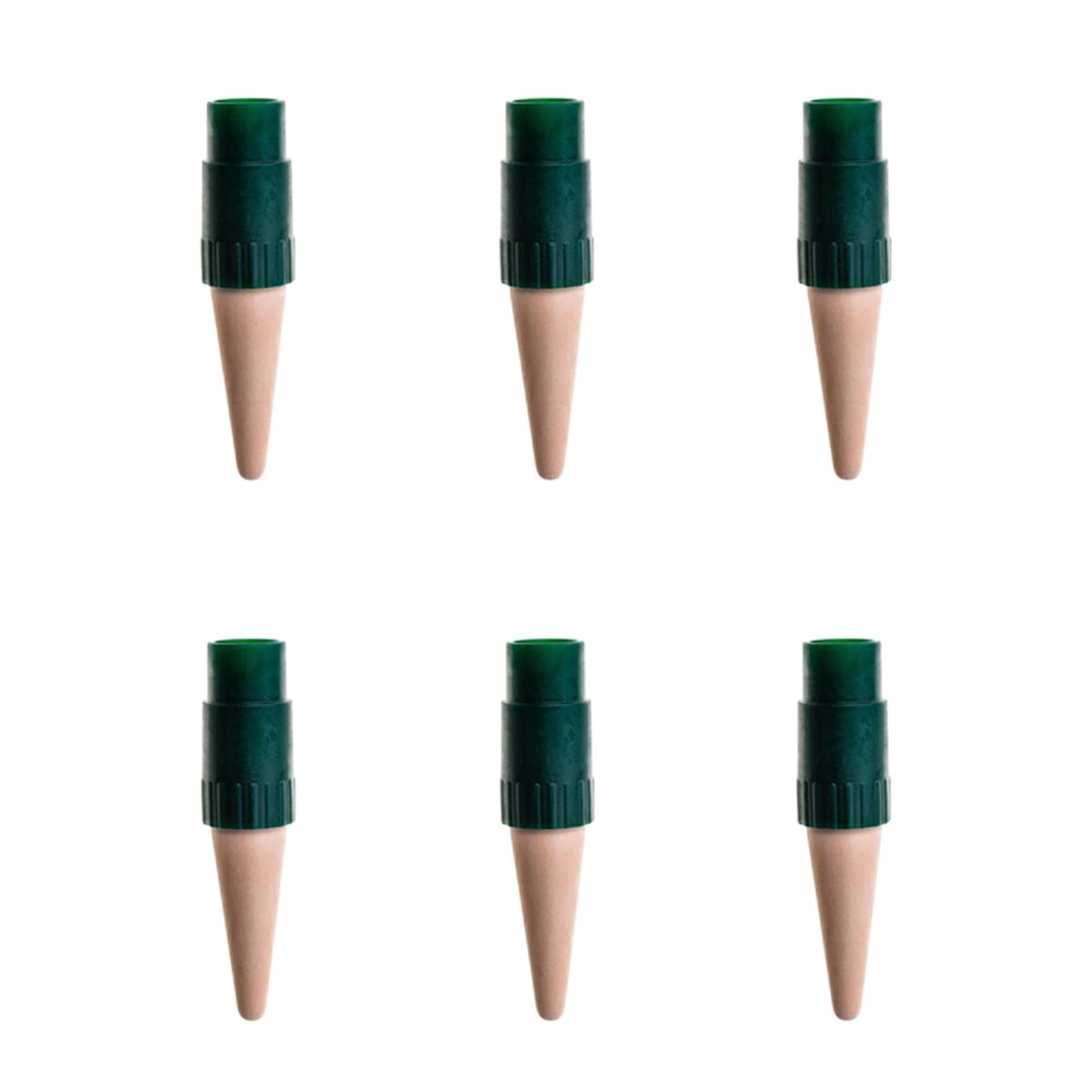 Set of six wooden plant markers with green plastic caps on a white background