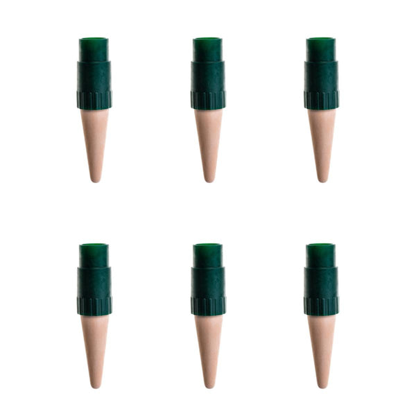 Set of six wooden plant markers with green plastic caps on a white background