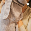 Close-up of Thistle knitted baby blanket showing soft cotton texture and stitch detail by Plum+Sparrow