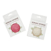 Two konjac sponges in packaging on a white background