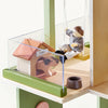 Playmobil toy set with a doghouse, dog figure, and child figure on a transparent platform.