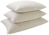 Three white pillows stacked on a white background with a visible brand logo.