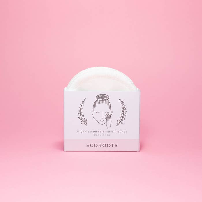 Ecoroots organic reusable facial rounds packaging on a pink background