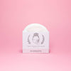 Ecoroots organic reusable facial rounds packaging on a pink background