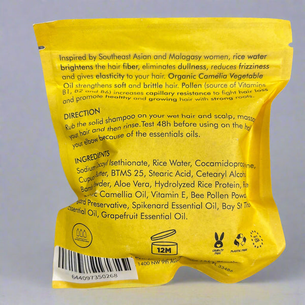 Yellow package with text and a barcode on a gray surface