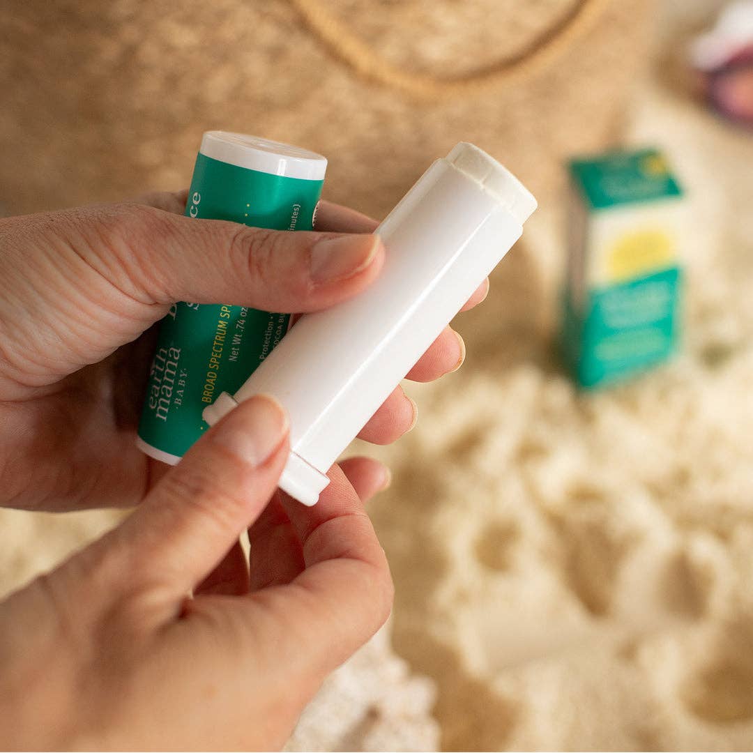 Earth Mama Baby Face Sunscreen Stick applied to baby's face, gentle mineral sun protection