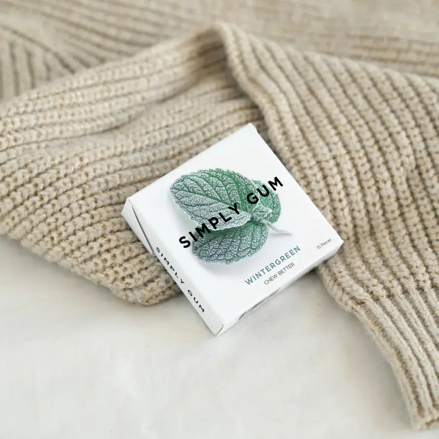 Box of Simply Gum on a textured beige surface