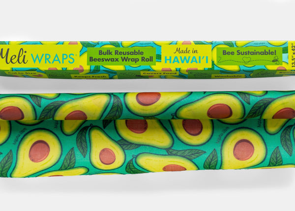Meli Wraps reusable beeswax wrap roll with avocado pattern on a white background