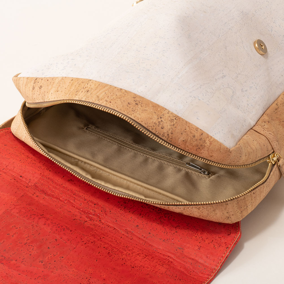 Cork handbag with a gold zipper on a white background