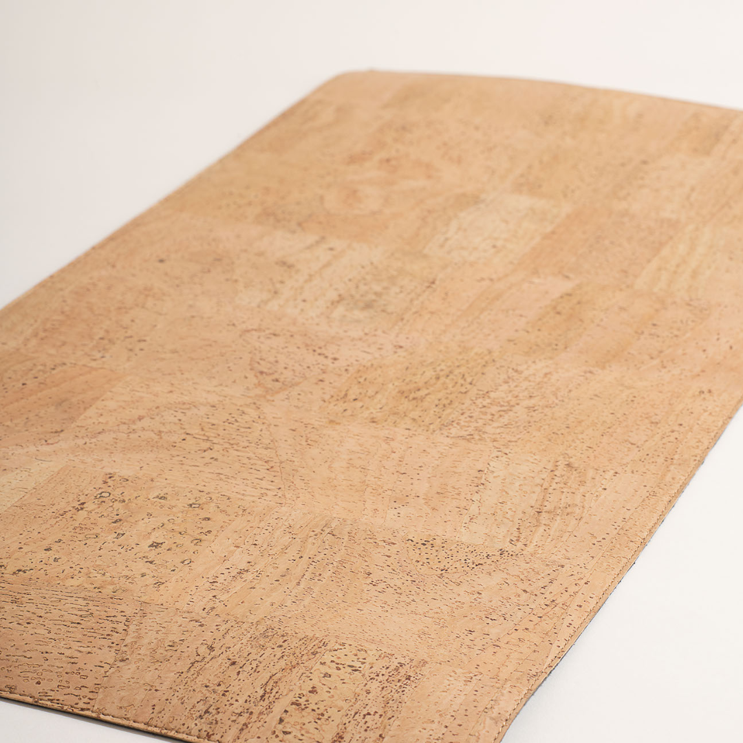 Beige cork mat on a white background